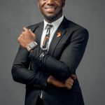 Smiling Man Posing in Studio Wearing Suit